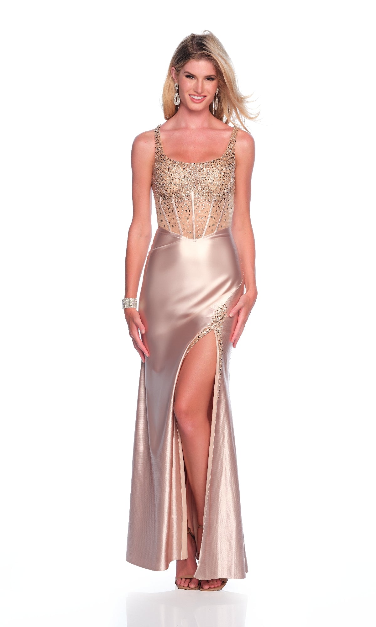 A woman poses elegantly against a white background in the Long Gold Prom Dress: Dave and Johnny 12289, featuring a sequin embellished bodice and thigh-high slit.